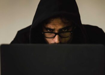 Photo by Sora Shimazaki: https://www.pexels.com/photo/crop-focused-hacker-in-hood-using-laptop-5926386/