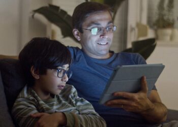 Photo by Kampus Production: https://www.pexels.com/photo/father-and-son-watching-video-7414064/