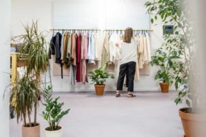 Photo by Ksenia Chernaya: https://www.pexels.com/photo/woman-fixing-clothes-on-the-rack-3965548/