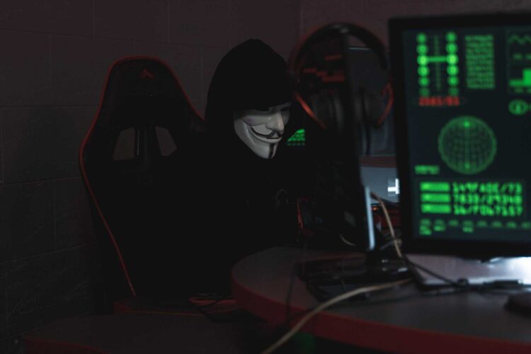Photo by Tima Miroshnichenko: https://www.pexels.com/photo/person-wearing-a-mask-sitting-on-chair-while-using-a-computer-5380605/