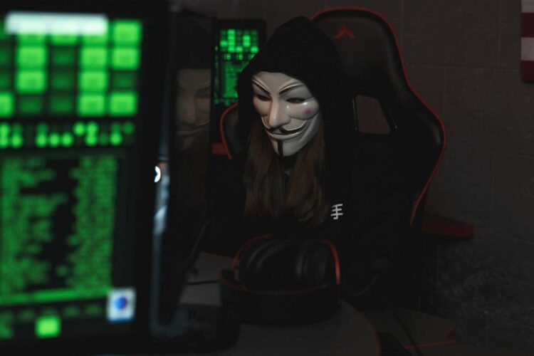 Photo by Tima Miroshnichenko: https://www.pexels.com/photo/person-with-mask-sitting-while-using-a-computer-5380610/