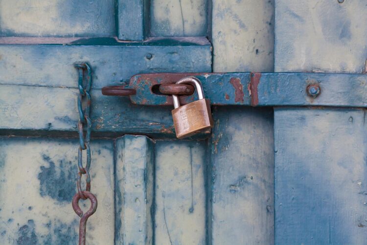Photo by Pixabay: https://www.pexels.com/photo/gold-padlock-locking-door-164425/