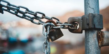Photo by Erik Mclean: https://www.pexels.com/photo/metal-chain-with-lock-on-street-6095837/