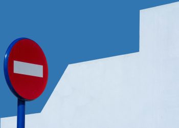 Photo by Jan van der Wolf: https://www.pexels.com/photo/a-red-and-blue-no-entry-sign-against-a-white-wall-27815871/