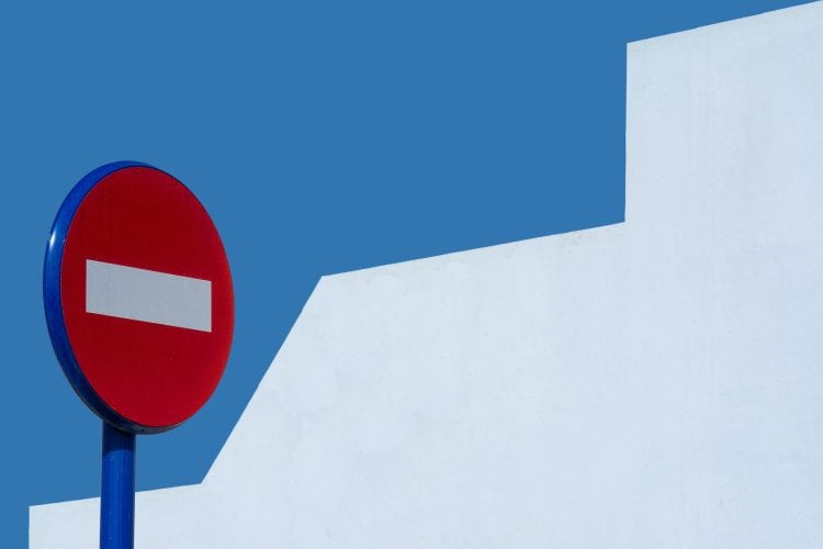 Photo by Jan van der Wolf: https://www.pexels.com/photo/a-red-and-blue-no-entry-sign-against-a-white-wall-27815871/