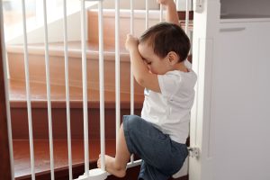 Photo by Jep Gambardella: https://www.pexels.com/photo/little-boy-trying-to-climb-up-a-stair-gate-6223621/